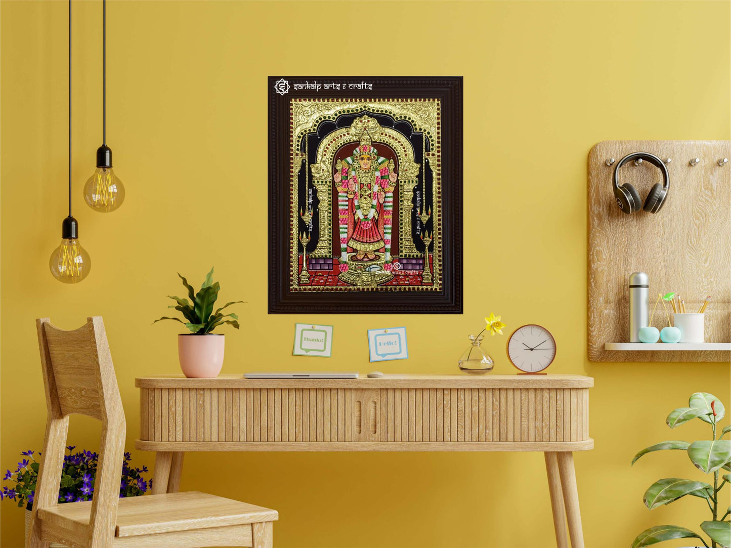 A framed Akilandeshwari Tanjore painting displayed as a wall hanging, enhancing the beauty of a room with its classical design and exquisite detailing.