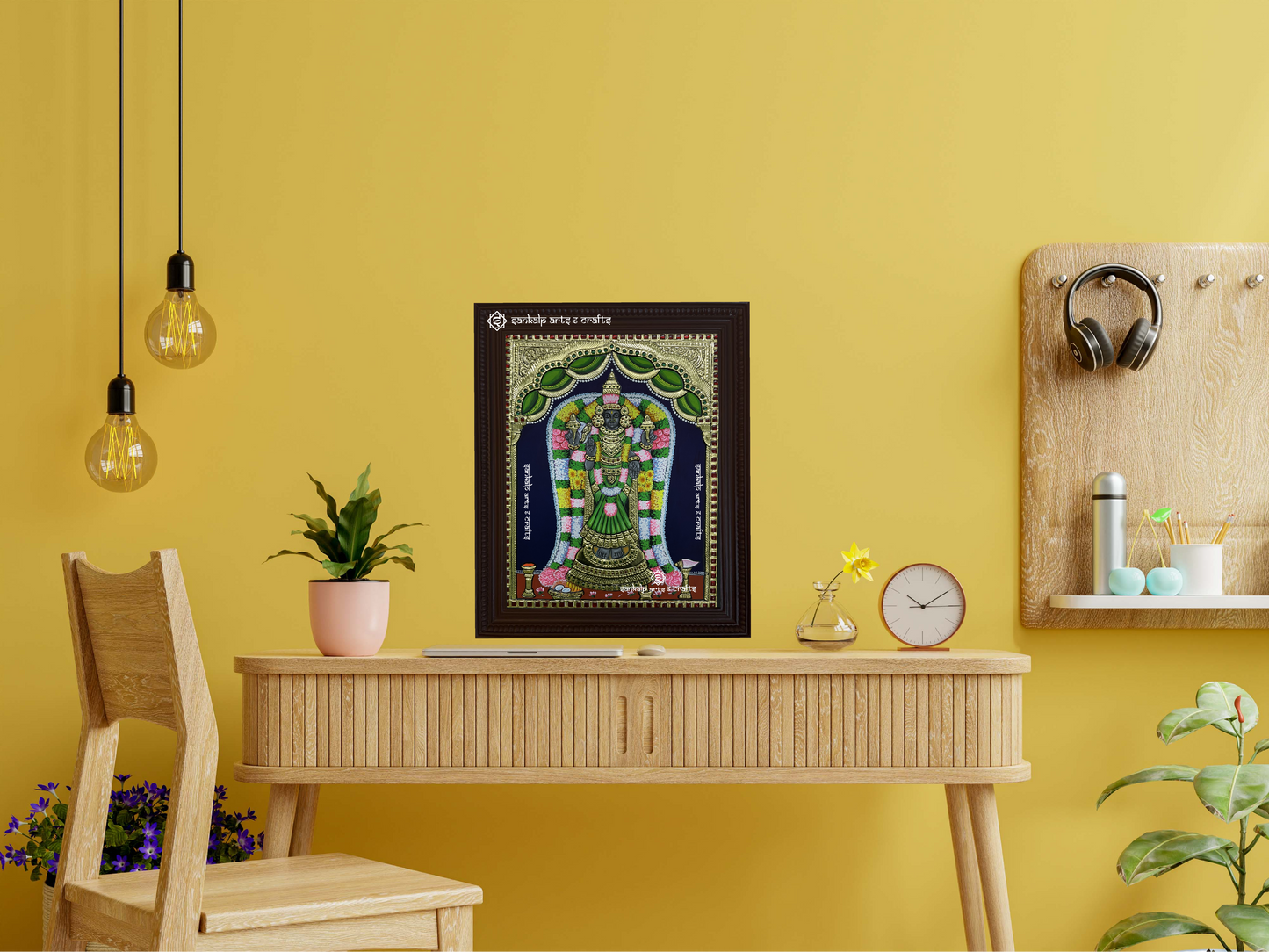 Akilandeshwari Tanjore painting in a wall-hanging frame, featuring the goddess in a green saree, with vibrant colors and intricate details in traditional Indian art style.