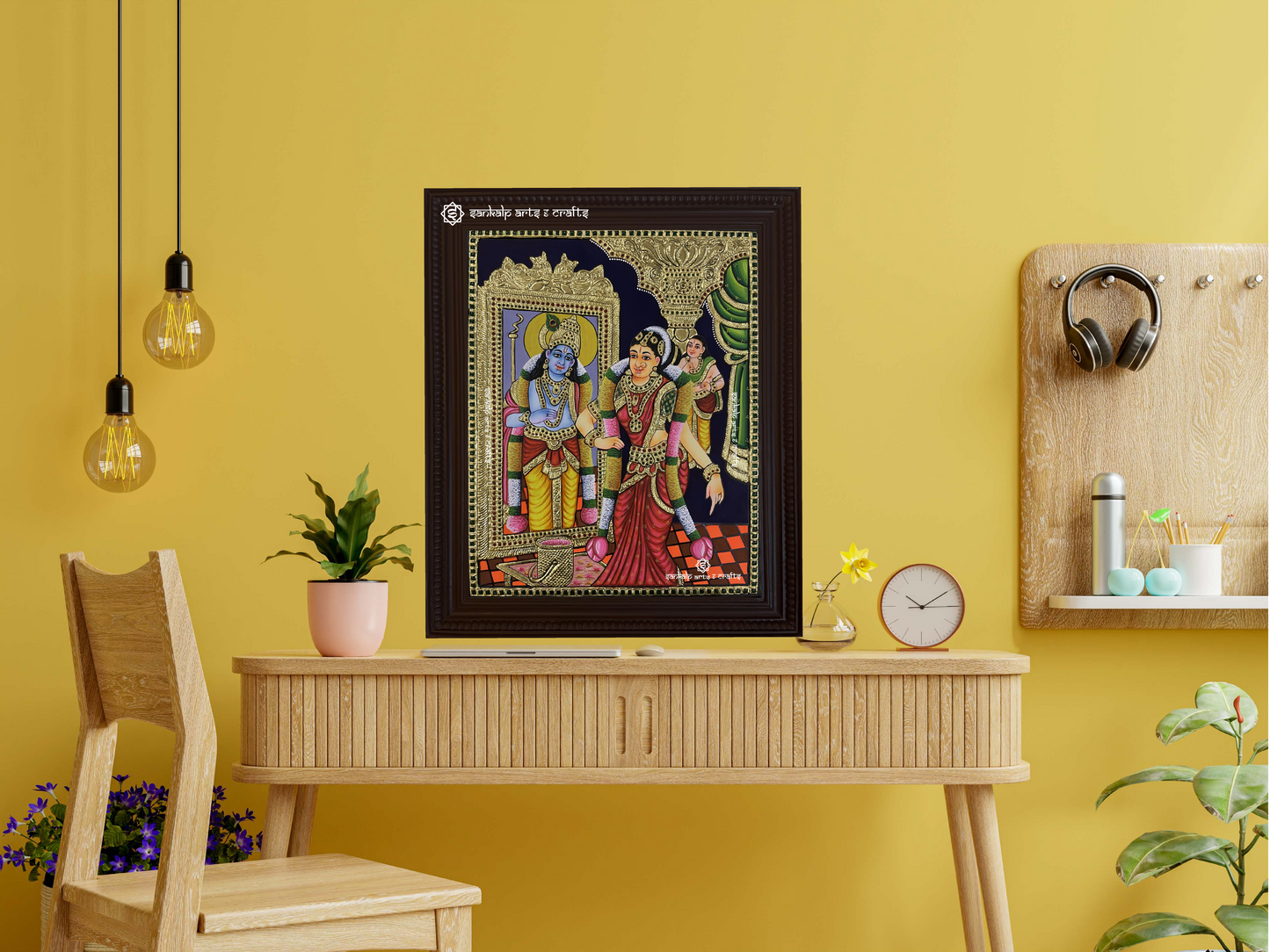 A framed Andal Tanjore painting displayed as a wall hanging, radiating divine grace with its intricate artwork, traditional gold embellishments, and vibrant hues.