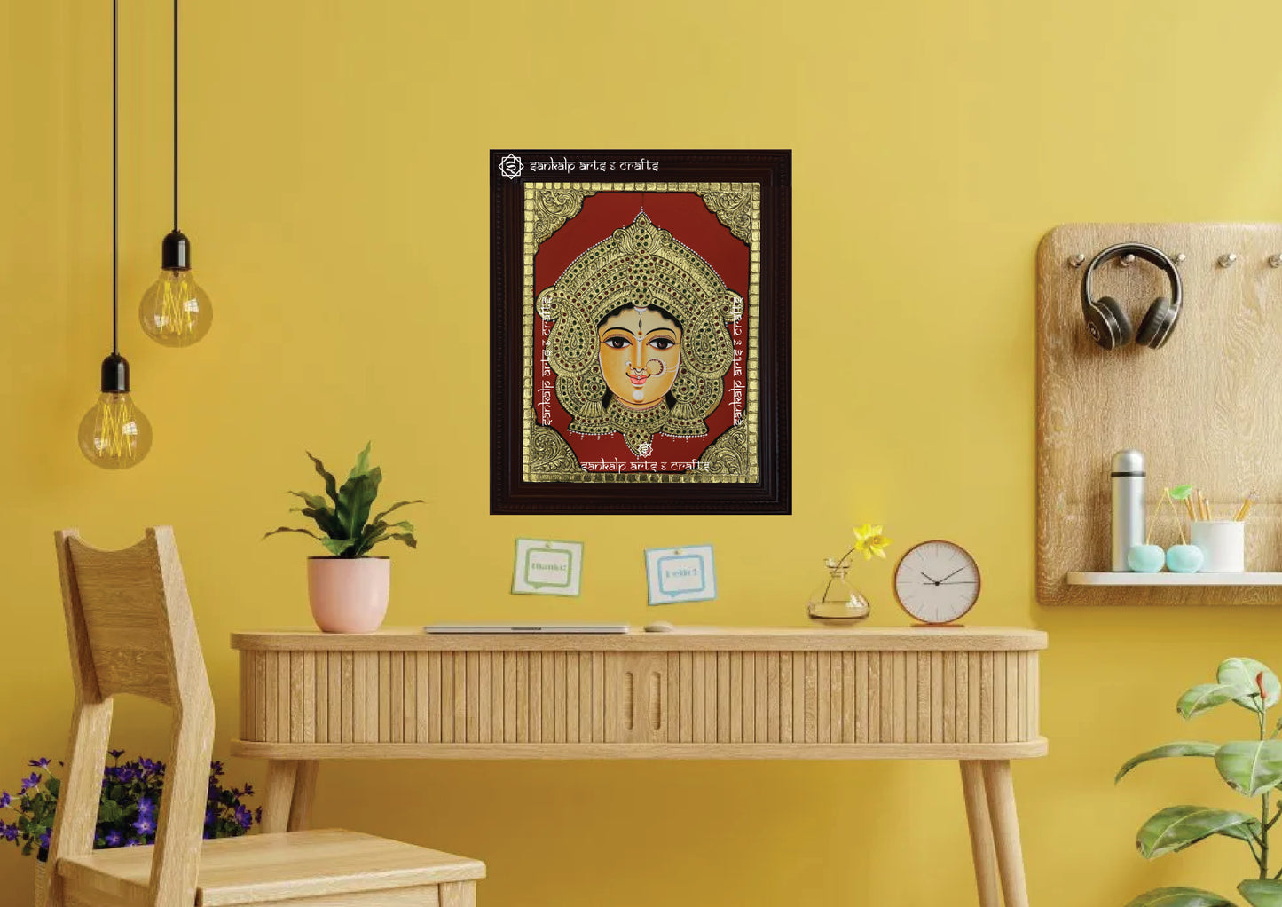 A framed Durga Devi Tanjore painting, radiating divine energy with intricate gold work and vibrant hues, perfect for enhancing the spiritual ambiance of your pooja room or living space with protection and strength.