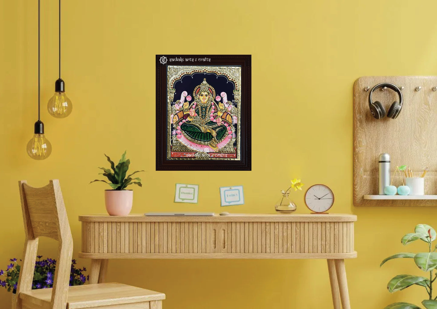 A framed Gajalakshmi Tanjore painting, radiating divine energy with intricate gold work and vibrant colors, perfect for inviting prosperity, positivity, and blessings into your pooja room or living space.