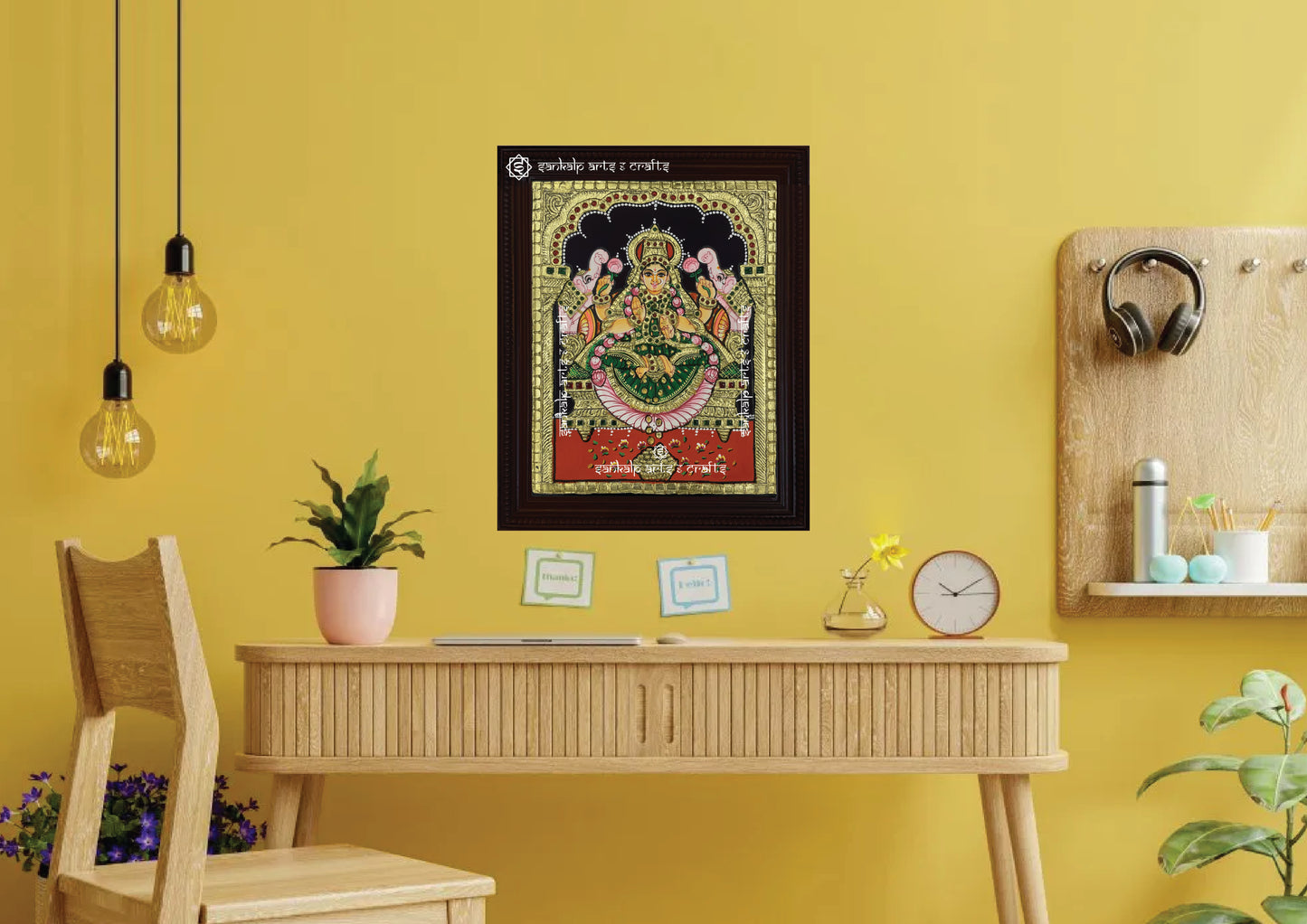 A framed Gajalakshmi Tanjore painting, radiating divine energy with detailed gold work and vibrant colors, perfect for bringing wealth, prosperity, and spiritual elegance to your pooja room or living space.