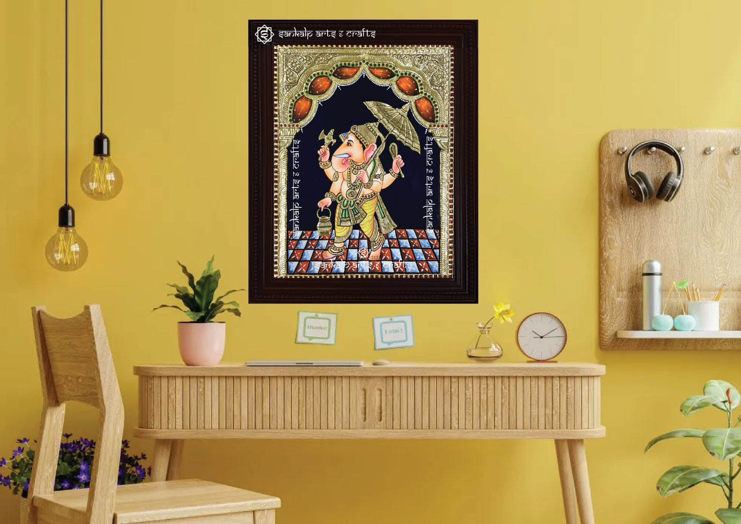 A framed Kodai Vinayagar Tanjore painting, featuring Lord Ganesha seated under an intricately designed umbrella, enriched with gold foil embellishments. Available in Chennai & Bangalore, this sacred artwork is ideal for temples, homes, and devotional spaces.