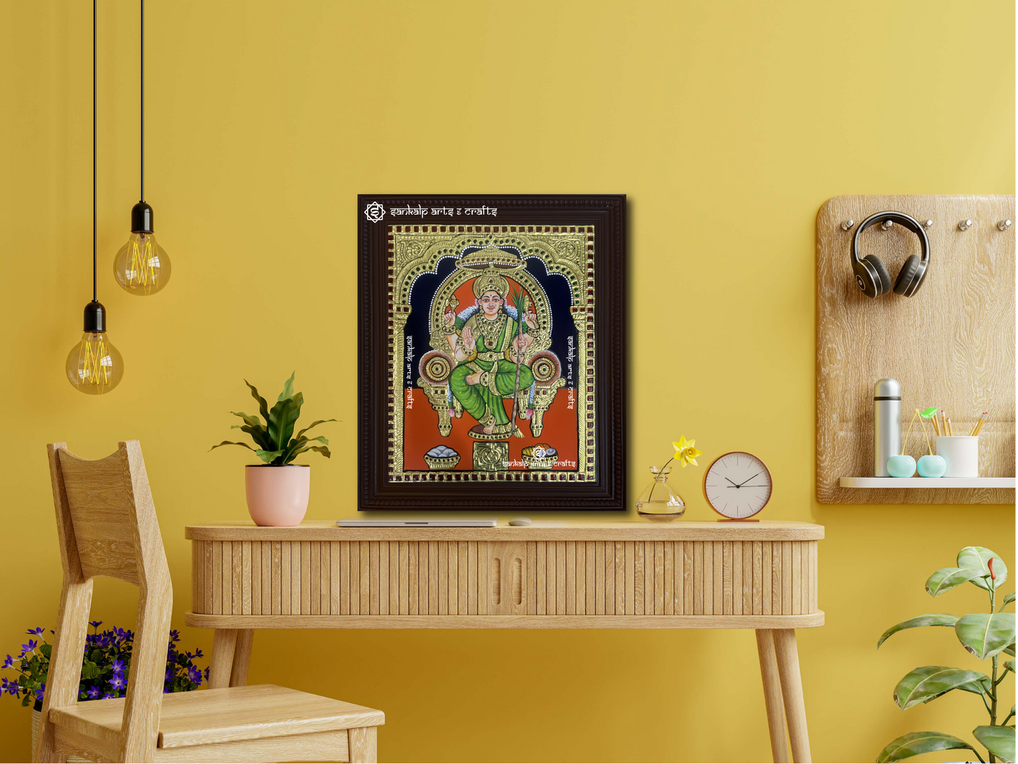 A framed Lalitha Parameshwari Tanjore painting displayed as a wall hanging, radiating spiritual energy with its intricate gold detailing, divine Chakram, and exquisite craftsmanship.