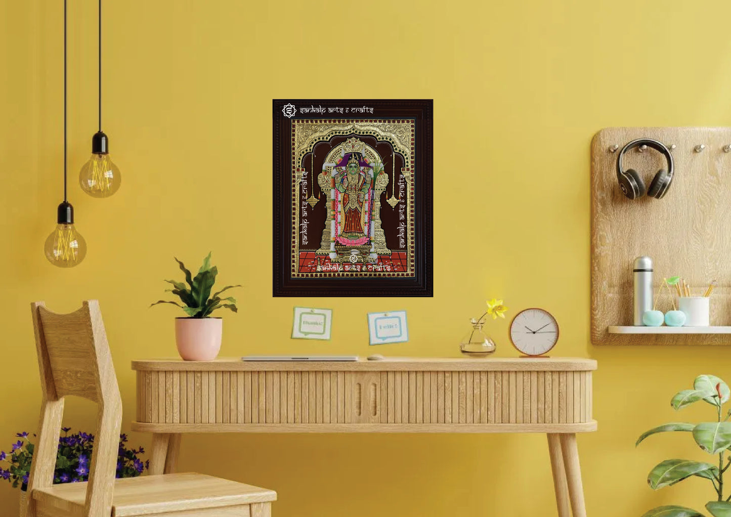 A framed Meenakshi Amman Tanjore painting, radiating divine energy with intricate gold work and vibrant hues, perfect for adding spiritual elegance and protection to your pooja room or living space.