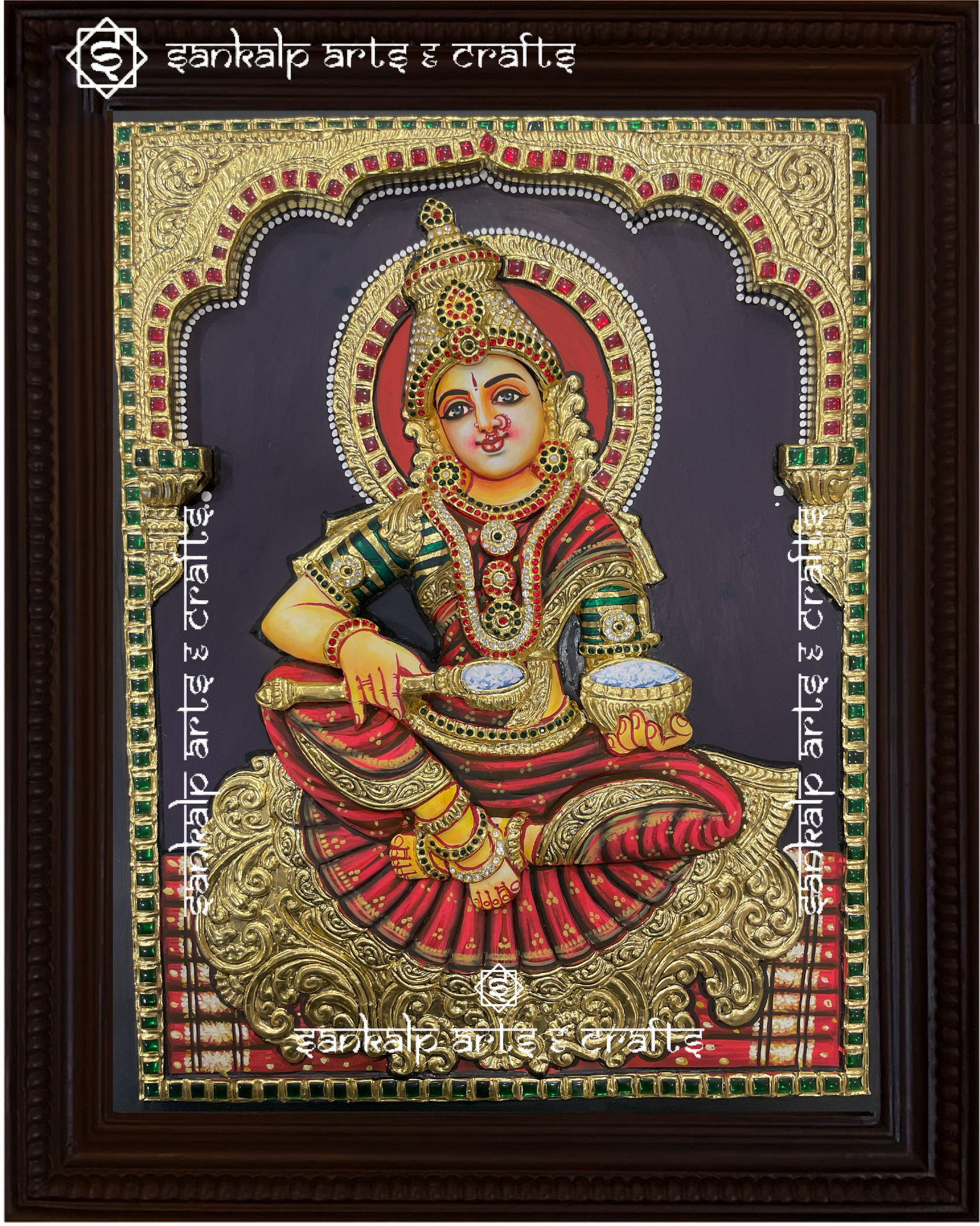 A mesmerizing 3D Annapoorni Tanjore painting, featuring the goddess of nourishment with intricate gold foil detailing and a layered, three-dimensional effect for a lifelike presence.

