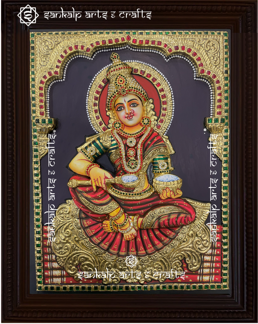 A mesmerizing 3D Annapoorni Tanjore painting, featuring the goddess of nourishment with intricate gold foil detailing and a layered, three-dimensional effect for a lifelike presence.

