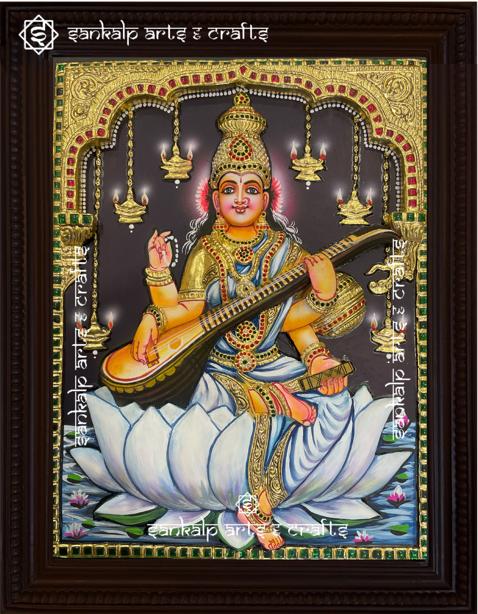 A beautifully framed 3D Tanjore painting of Goddess Saraswathi, showcasing intricate gold detailing and depth. A perfect decor piece for homes in Chennai & Bangalore.
