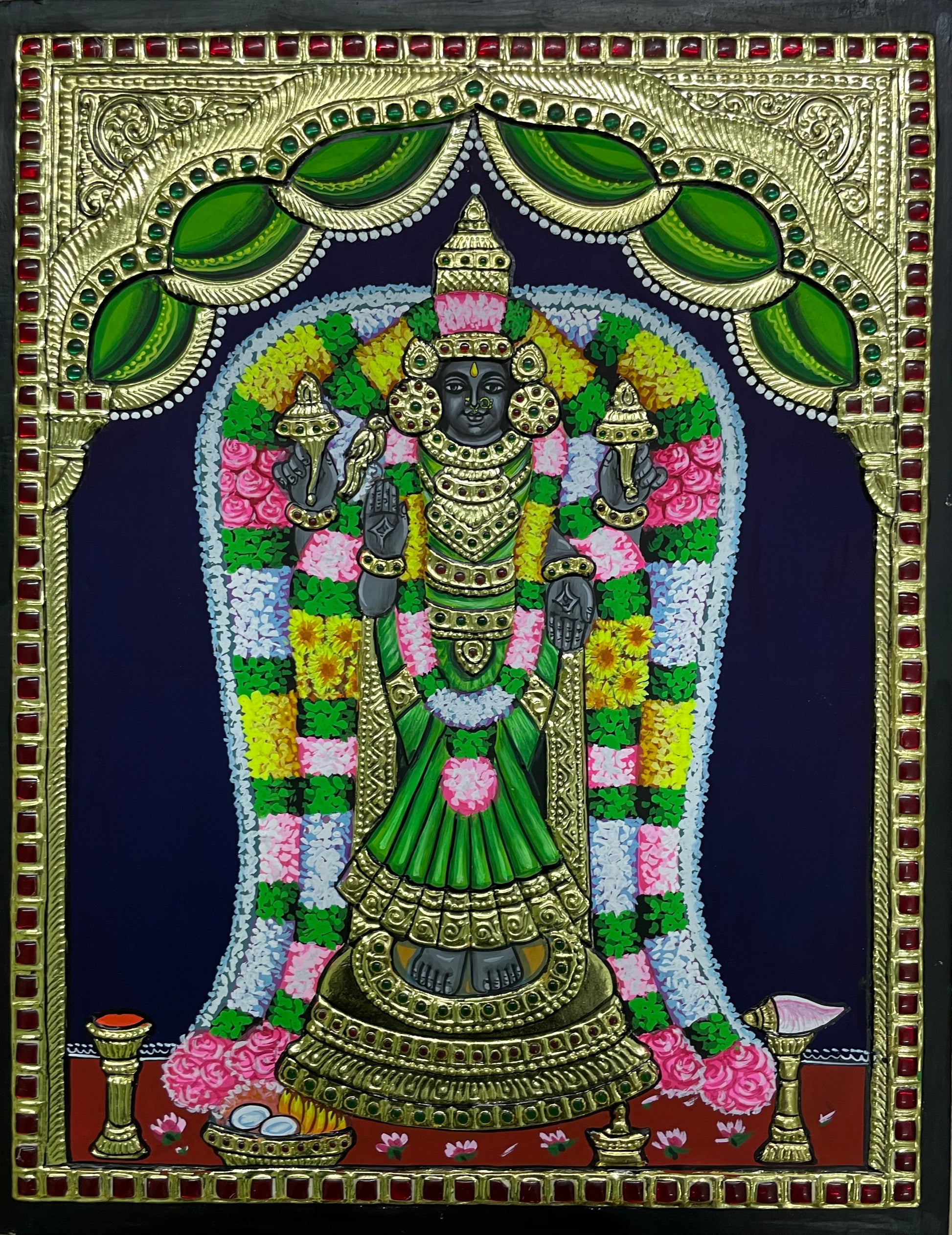 Akilandeshwari Tanjore painting featuring the goddess adorned in a green saree, with vibrant colors and intricate details in traditional Indian art style.