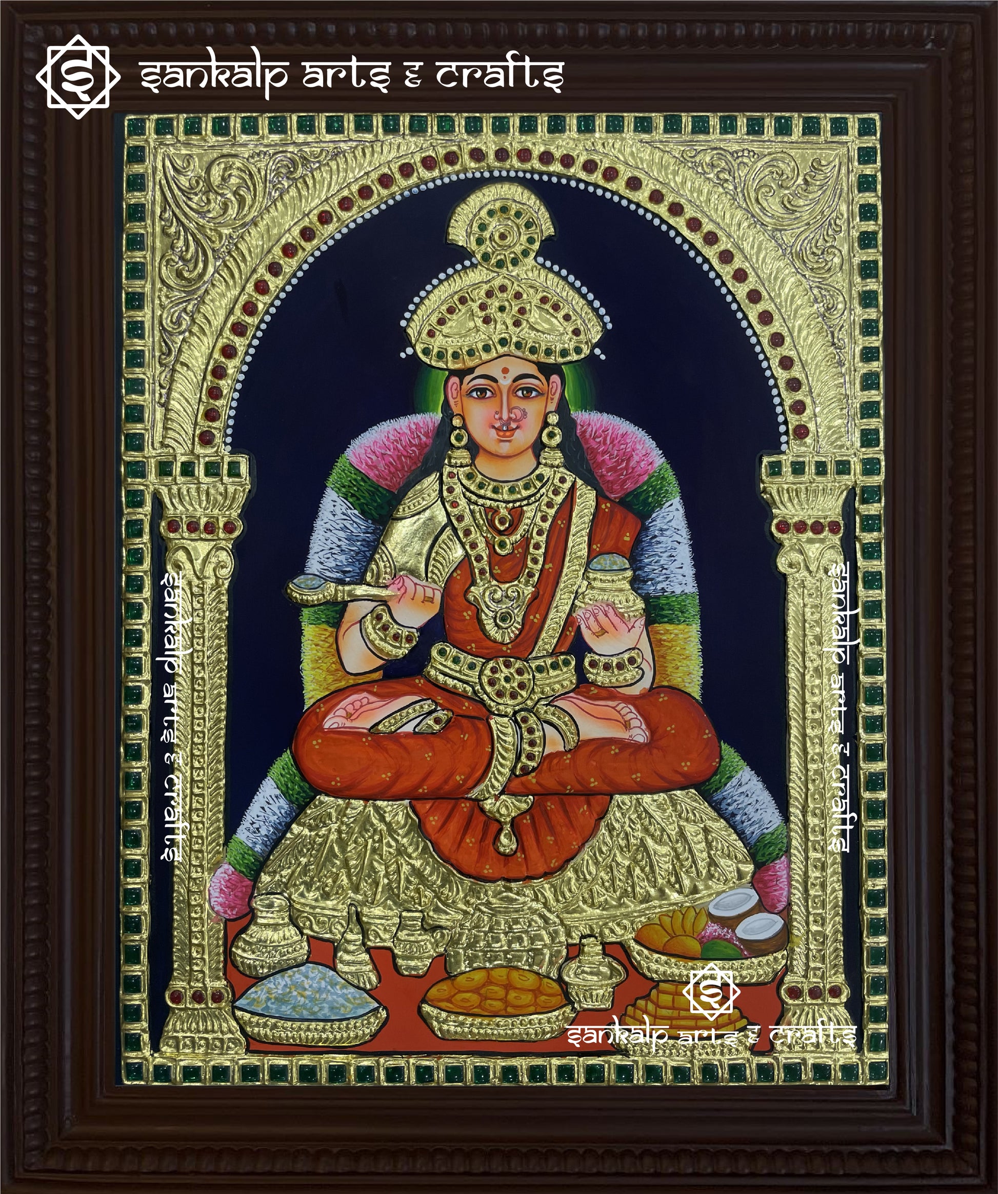 A beautifully handcrafted Annapoorani Tanjore painting depicting the goddess of food and prosperity, adorned with intricate gold foil work and rich traditional colors.

