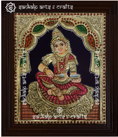 A beautiful Annapoorni Tanjore painting, showcasing the goddess of nourishment in vibrant colors with intricate gold foil detailing, symbolizing abundance and grace.