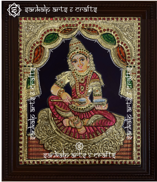 A beautiful Annapoorni Tanjore painting, showcasing the goddess of nourishment in vibrant colors with intricate gold foil detailing, symbolizing abundance and grace.