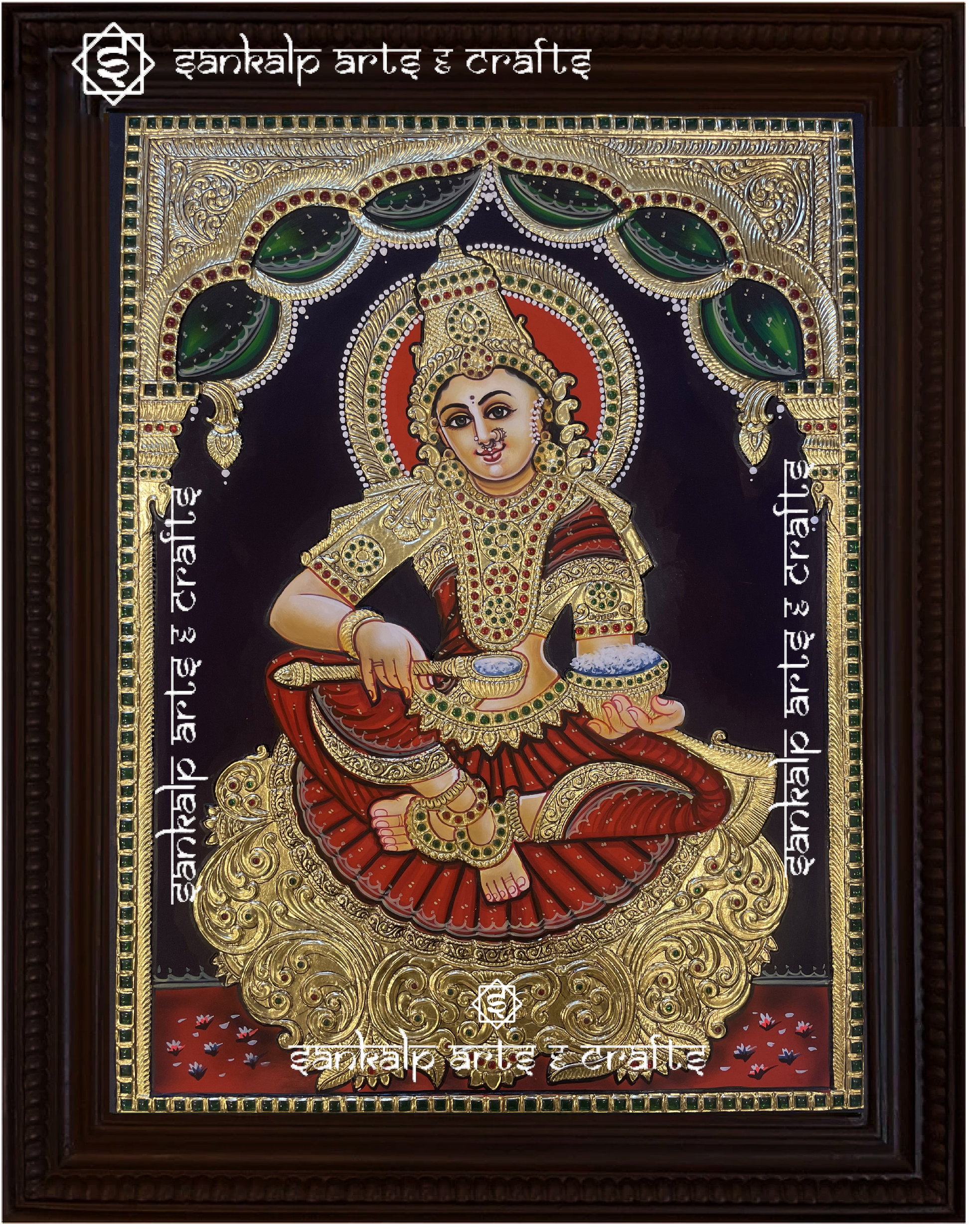 A stunning Annapoorni Tanjore painting depicting the goddess of food and prosperity, adorned with intricate gold foil work, vibrant traditional colors, and detailed craftsmanship.