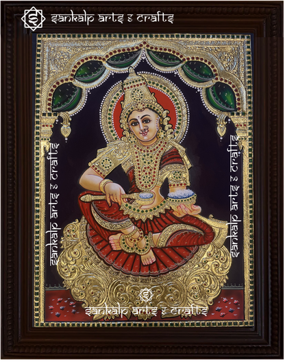 A stunning Annapoorni Tanjore painting depicting the goddess of food and prosperity, adorned with intricate gold foil work, vibrant traditional colors, and detailed craftsmanship.