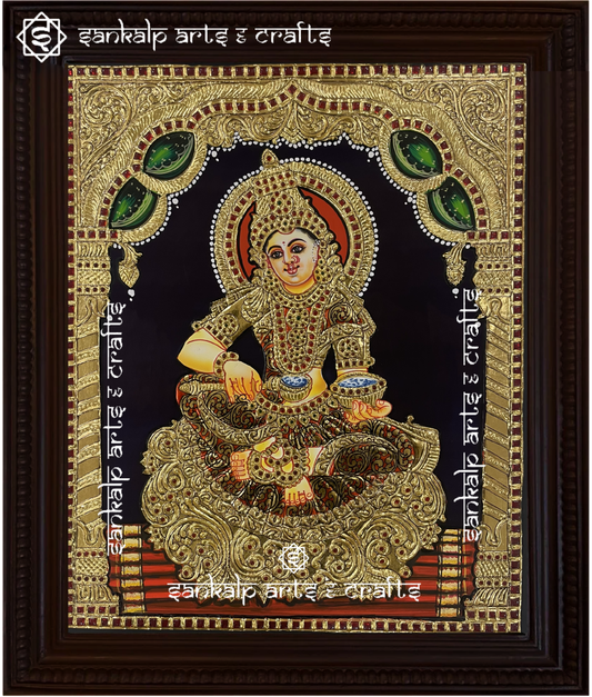 A beautifully handcrafted Annapoorni Tanjore painting featuring the goddess of nourishment, adorned with intricate gold foil detailing and vibrant traditional colors.


