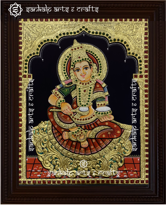 A stunning Annapoorni Tanjore painting from Chennai, featuring the goddess of nourishment in vibrant colors with intricate gold foil detailing, symbolizing abundance and grace.

