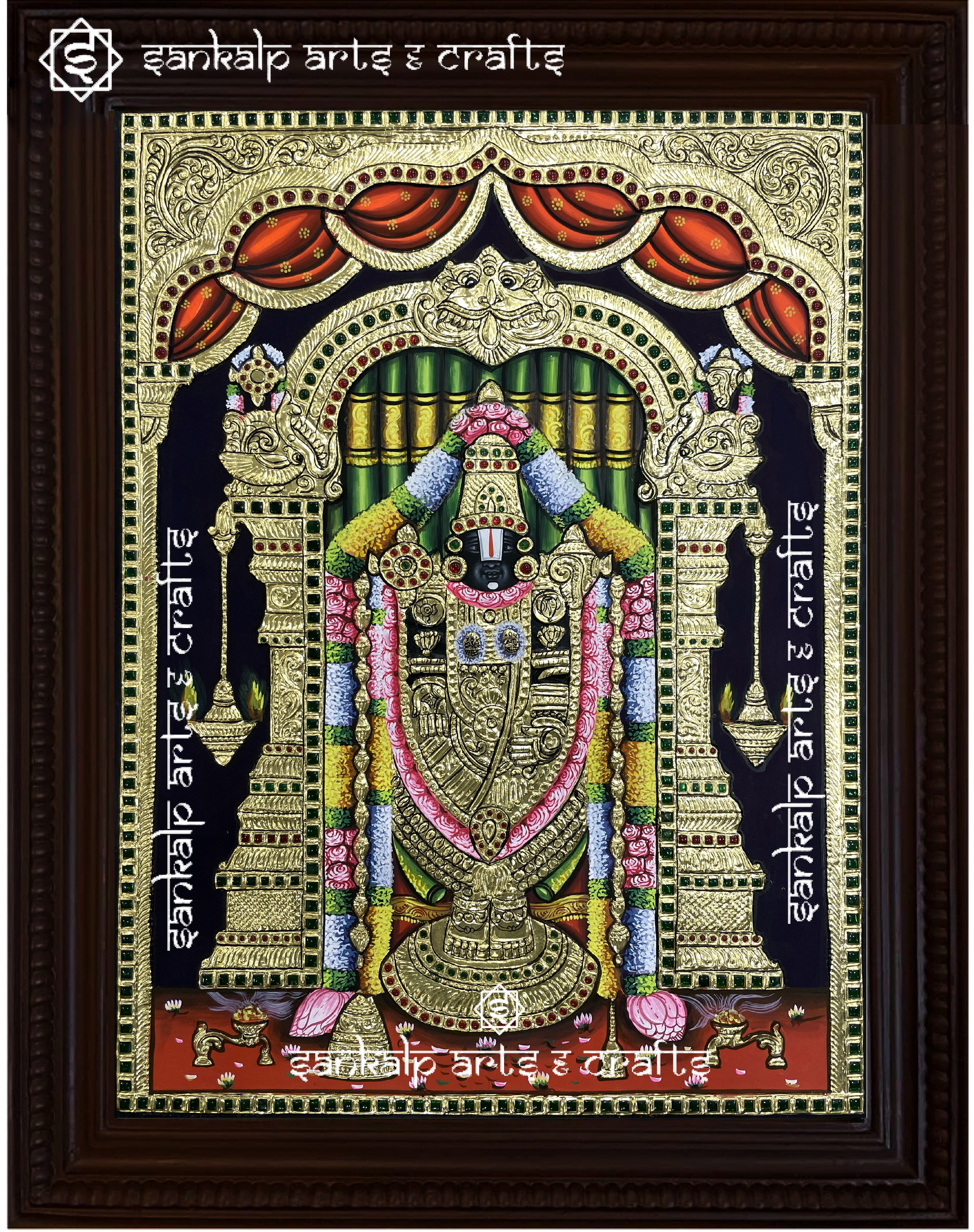 A close-up of the Balaji Tanjore painting, showcasing Lord Venkateswara with his consorts, enhanced with exquisite gold foil work and rich hues, representing blessings, peace, and divine grace.

