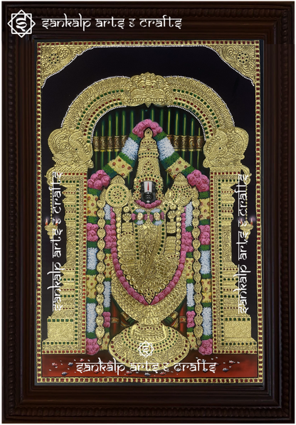 A beautifully framed Tanjore painting of Lord Balaji, featuring intricate gold detailing and vibrant colors. A perfect decor piece for homes in Chennai & Bangalore.