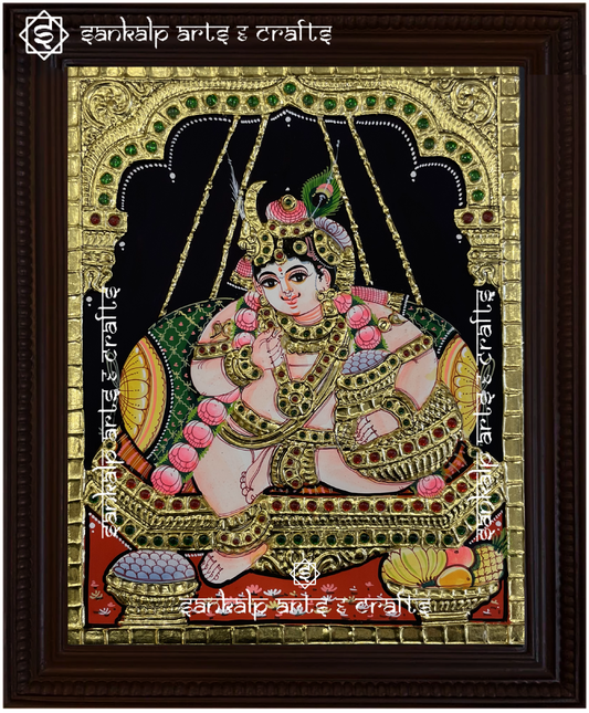 A handcrafted Butter Krishna Tanjore painting, adorned with rich gold foil and intricate details, framed to enhance divine decor in Chennai & Bangalore.
