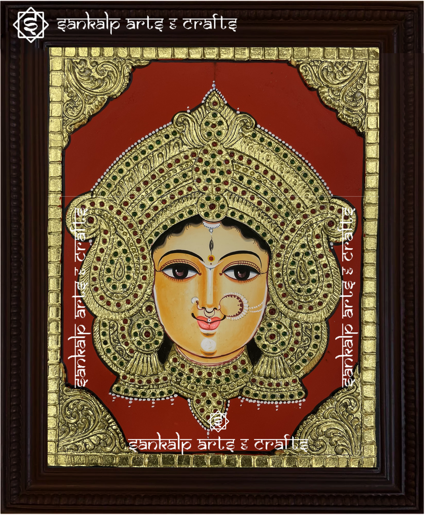 A close-up of the Durga Devi Tanjore painting showcasing Goddess Durga with her weapons, beautifully embellished with gold leaf and rich colors, radiating strength, protection, and spiritual power.


