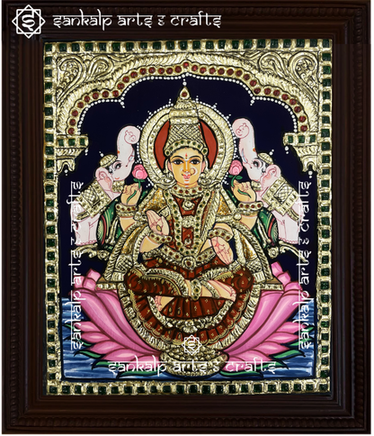 A beautifully handcrafted Gajalakshmi Tanjore painting depicting Goddess Lakshmi surrounded by two elephants, symbolizing wealth, prosperity, and abundance. The painting features intricate gold foil detailing and vibrant colors that bring divine blessings into your space.

