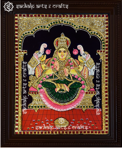 A stunning Tanjore painting of Goddess Gajalakshmi, seated with elephants showering blessings. A perfect spiritual decor piece for homes in Chennai & Bangalore.

