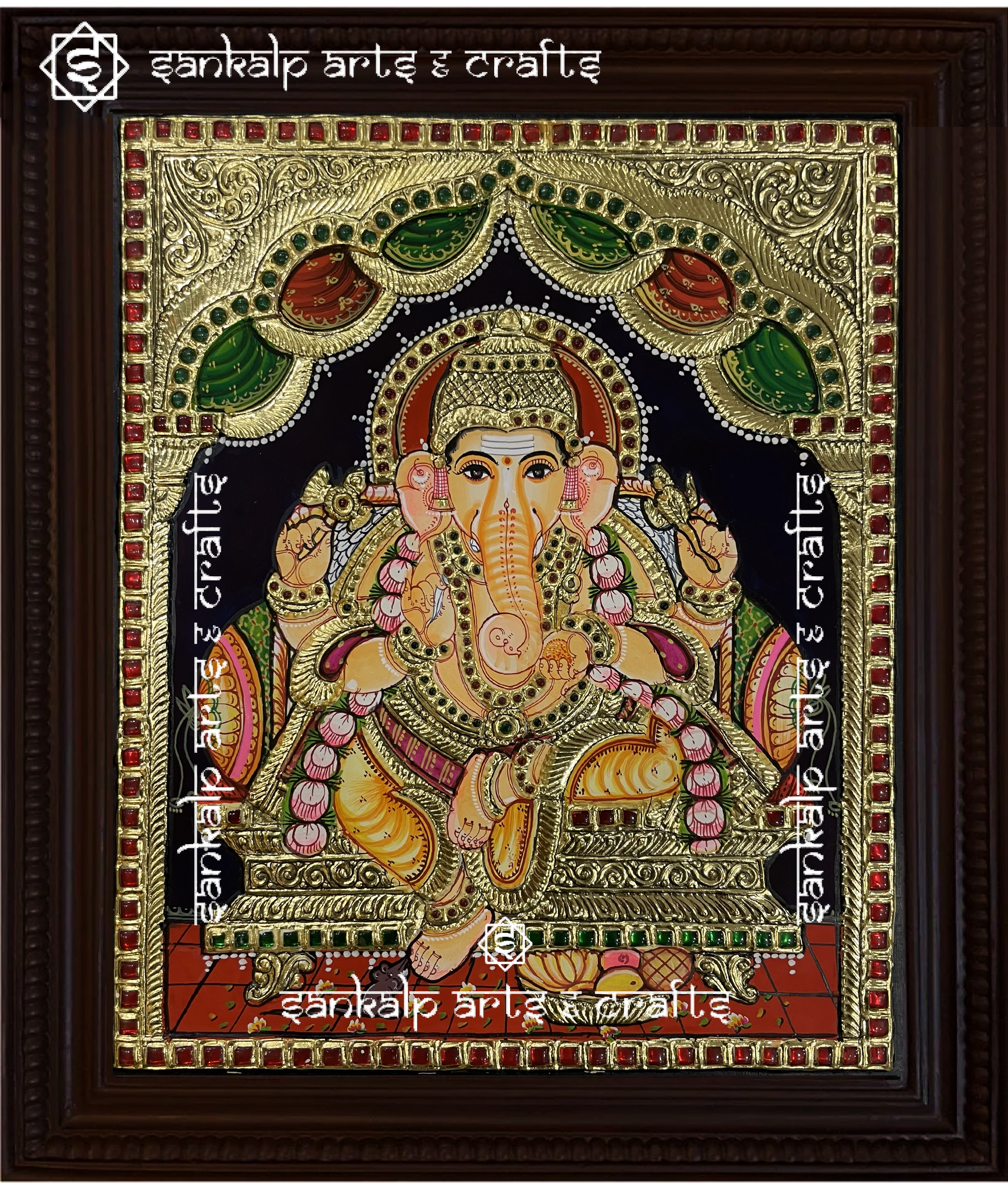 A beautifully handcrafted Ganesha Tanjore painting depicting Lord Ganesha seated gracefully, adorned with gold foil detailing and vibrant colors. This masterpiece symbolizes wisdom, success, and prosperity.


