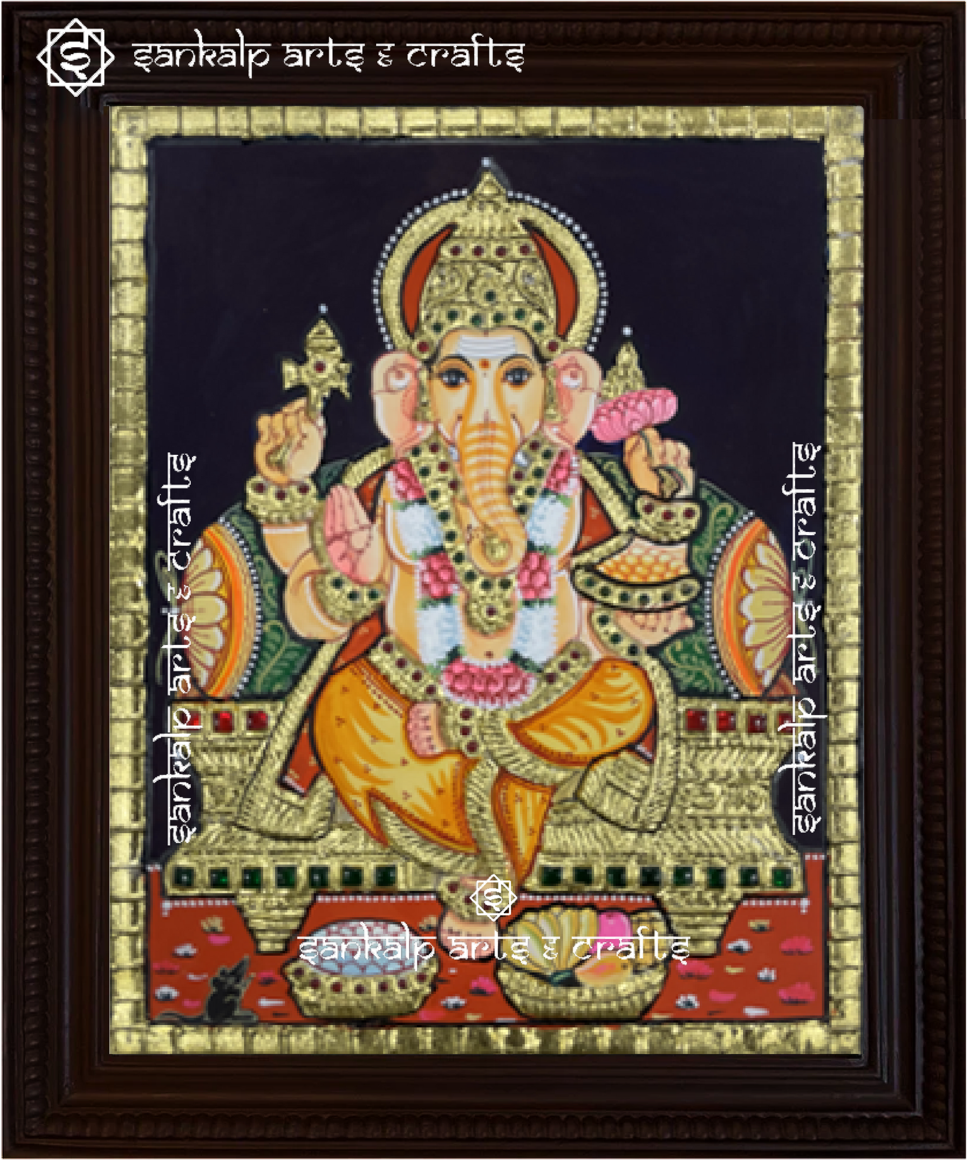 A beautifully framed Tanjore painting of Lord Ganesha, adorned with intricate gold foil and rich colors. A perfect decor piece for homes in Chennai & Bangalore.