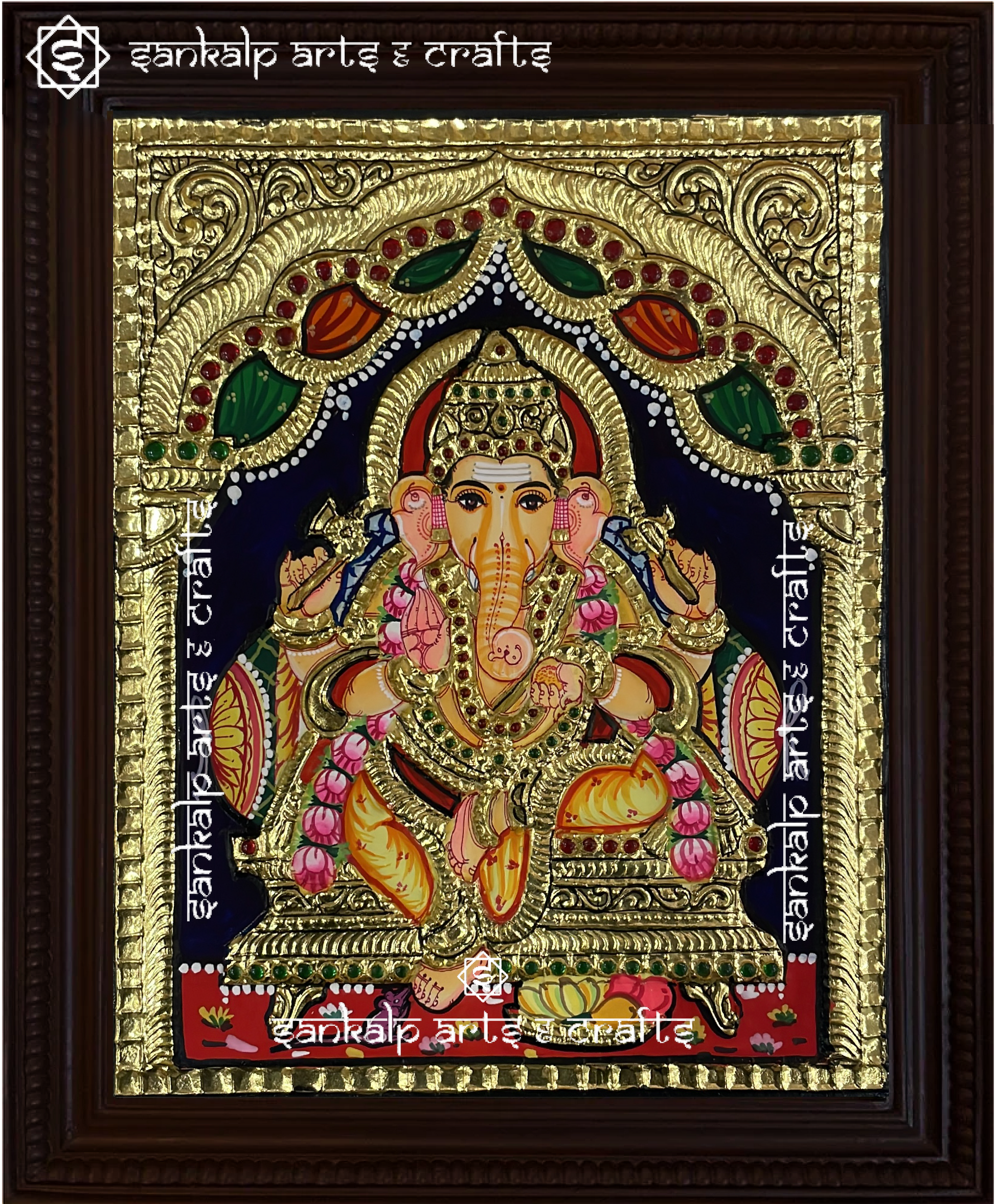 A beautifully handcrafted Tanjore painting of Lord Ganesha, adorned with rich gold foil and vibrant colors. A perfect decor piece for homes and temples in Chennai & Bangalore.

