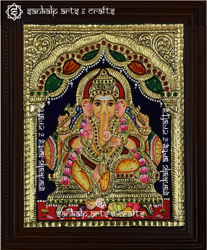 A beautifully handcrafted Tanjore painting of Lord Ganesha, adorned with rich gold foil and vibrant colors. A perfect decor piece for homes and temples in Chennai & Bangalore.

