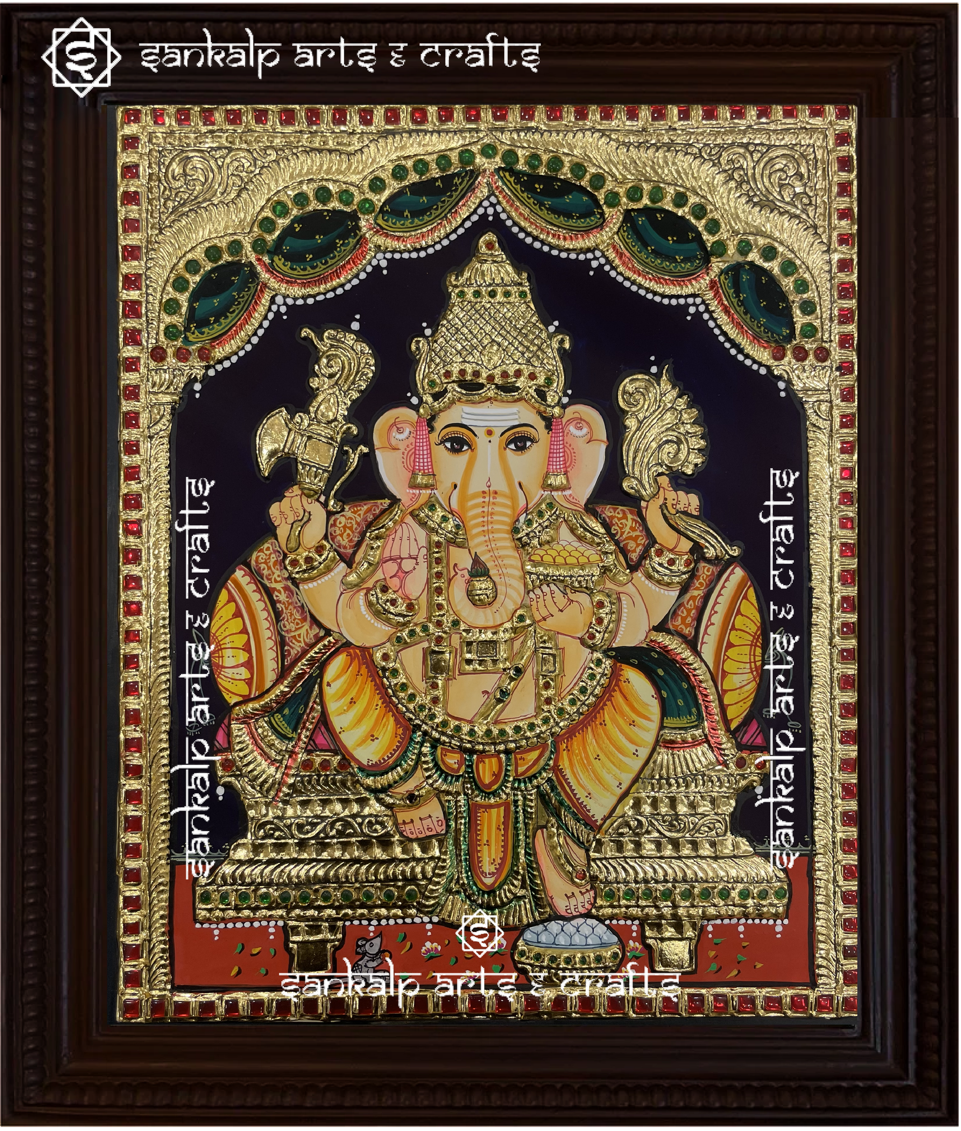 A beautifully framed Tanjore painting of Lord Ganesha, featuring rich gold foil work and vibrant colors. A perfect decor piece for homes in Chennai & Bangalore.

