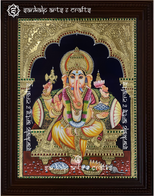 A beautifully framed Tanjore painting of Lord Ganesha, adorned with intricate gold foil work and rich colors. A perfect spiritual decor piece for homes in Chennai & Bangalore.

