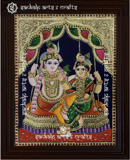A beautifully handcrafted Jhula Radhe Krishna Tanjore painting in South Indian style, depicting Lord Krishna and Radha joyfully seated on a swing. The vibrant colors and intricate gold foil detailing enhance the divine beauty of this artwork.

