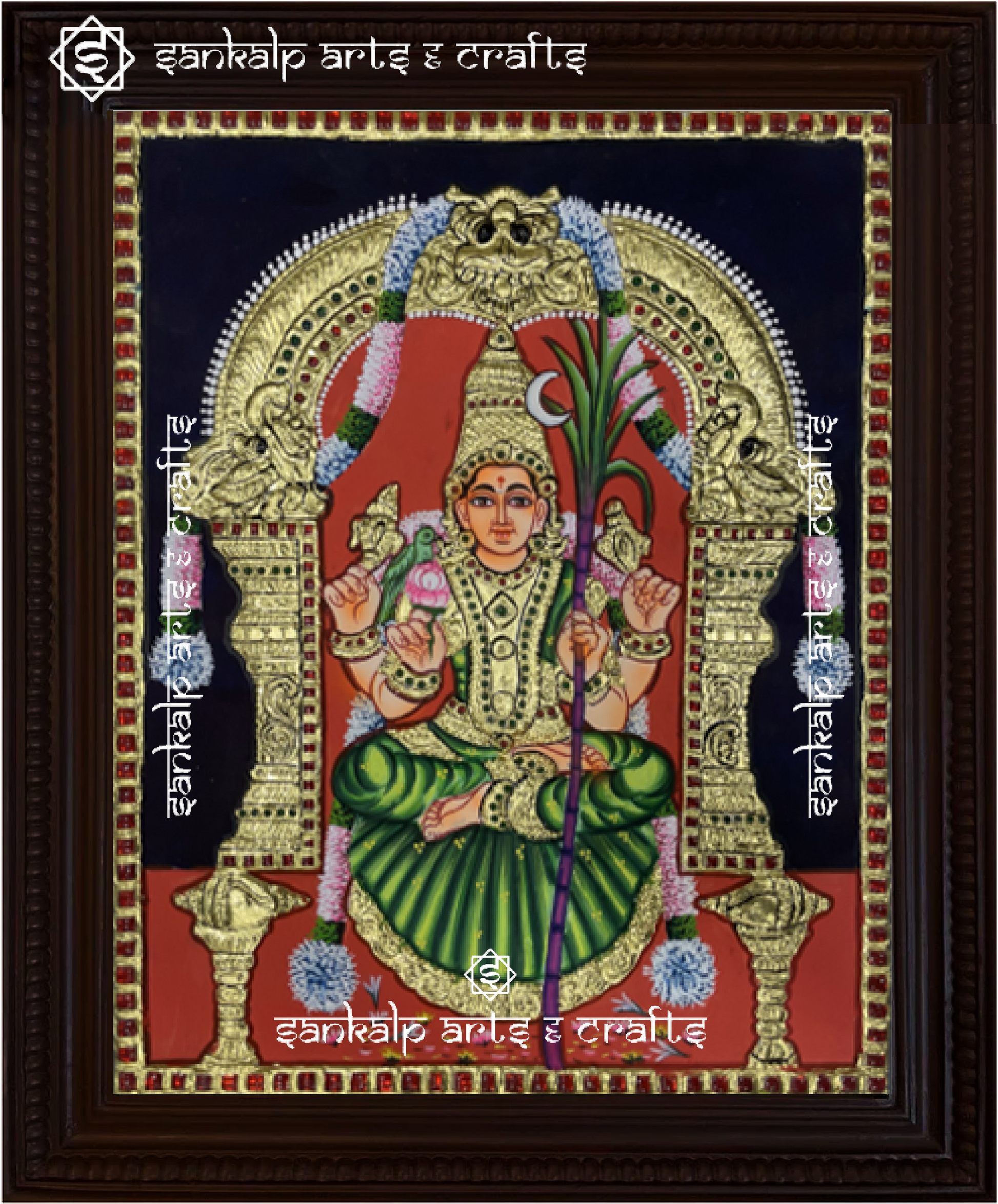A beautifully framed Tanjore painting of Goddess Kamakshi Amman, crafted with intricate gold foil work. A perfect decor piece for homes in Chennai & Bangalore.