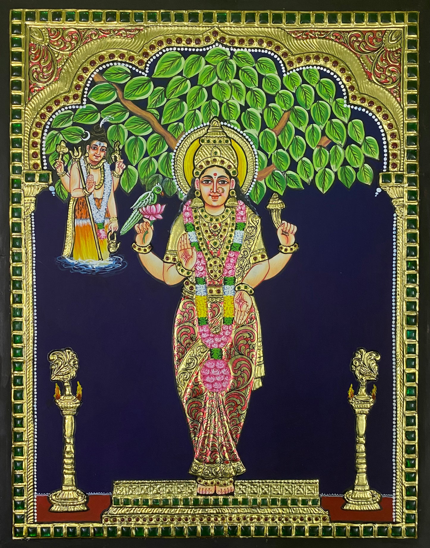 A close-up view of the Kanyaka Parameshwari Tanjore painting, showcasing the rich textures, delicate gold embellishments, and serene expression of the goddess.