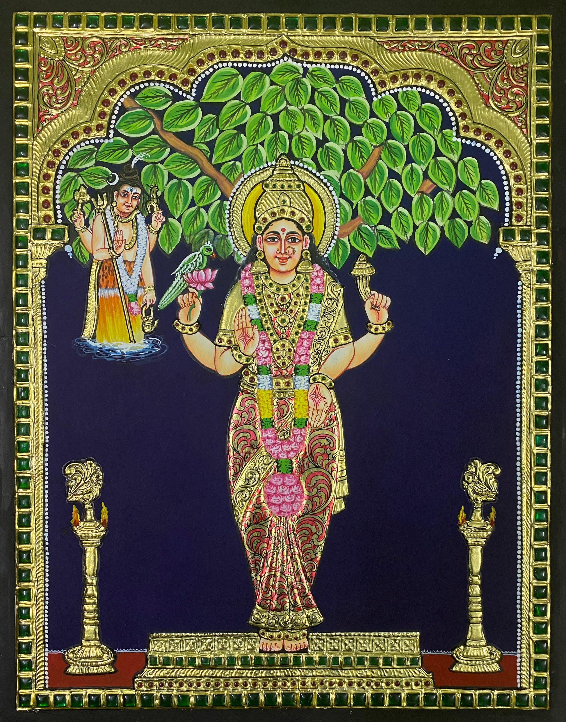 A close-up view of the Kanyaka Parameshwari Tanjore painting, showcasing the rich textures, delicate gold embellishments, and serene expression of the goddess.