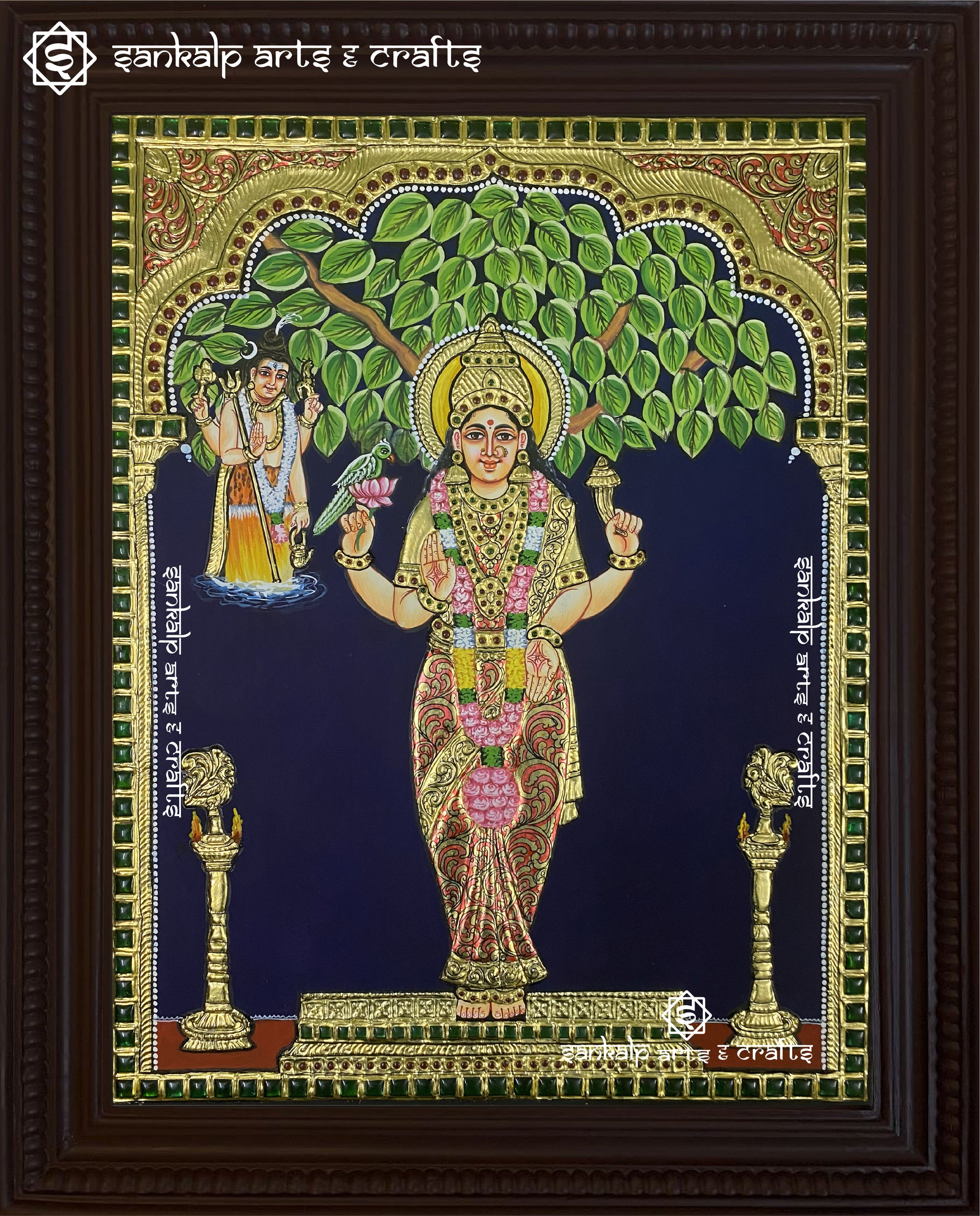 A beautifully crafted Kanyaka Parameshwari Tanjore painting, featuring intricate gold foil work, vibrant colors, and traditional detailing that capture the grace of the goddess.

