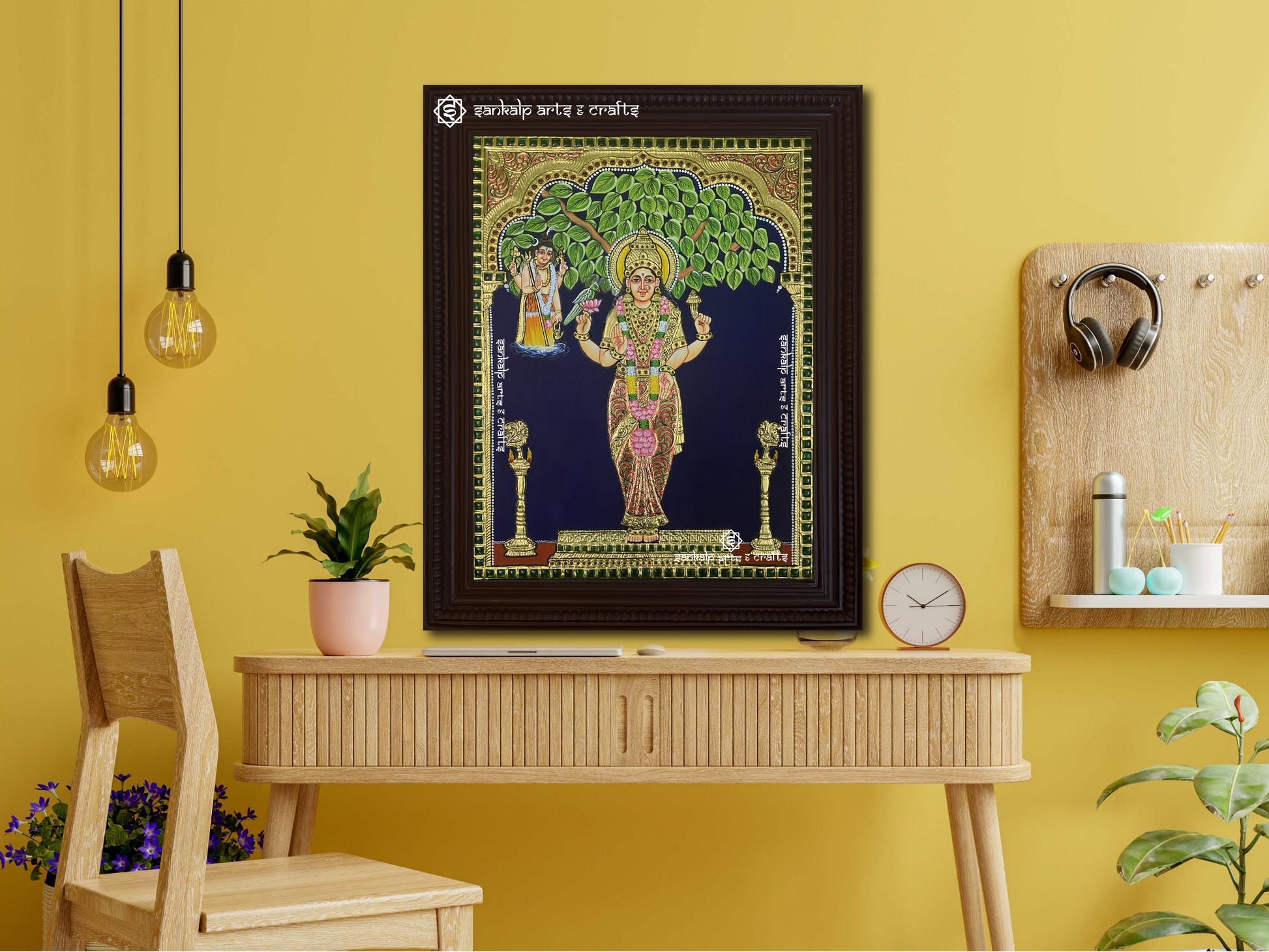 A framed Kanyaka Parameshwari Tanjore painting displayed as a wall hanging, enhancing the space with its intricate details, traditional artistry, and divine aura.
