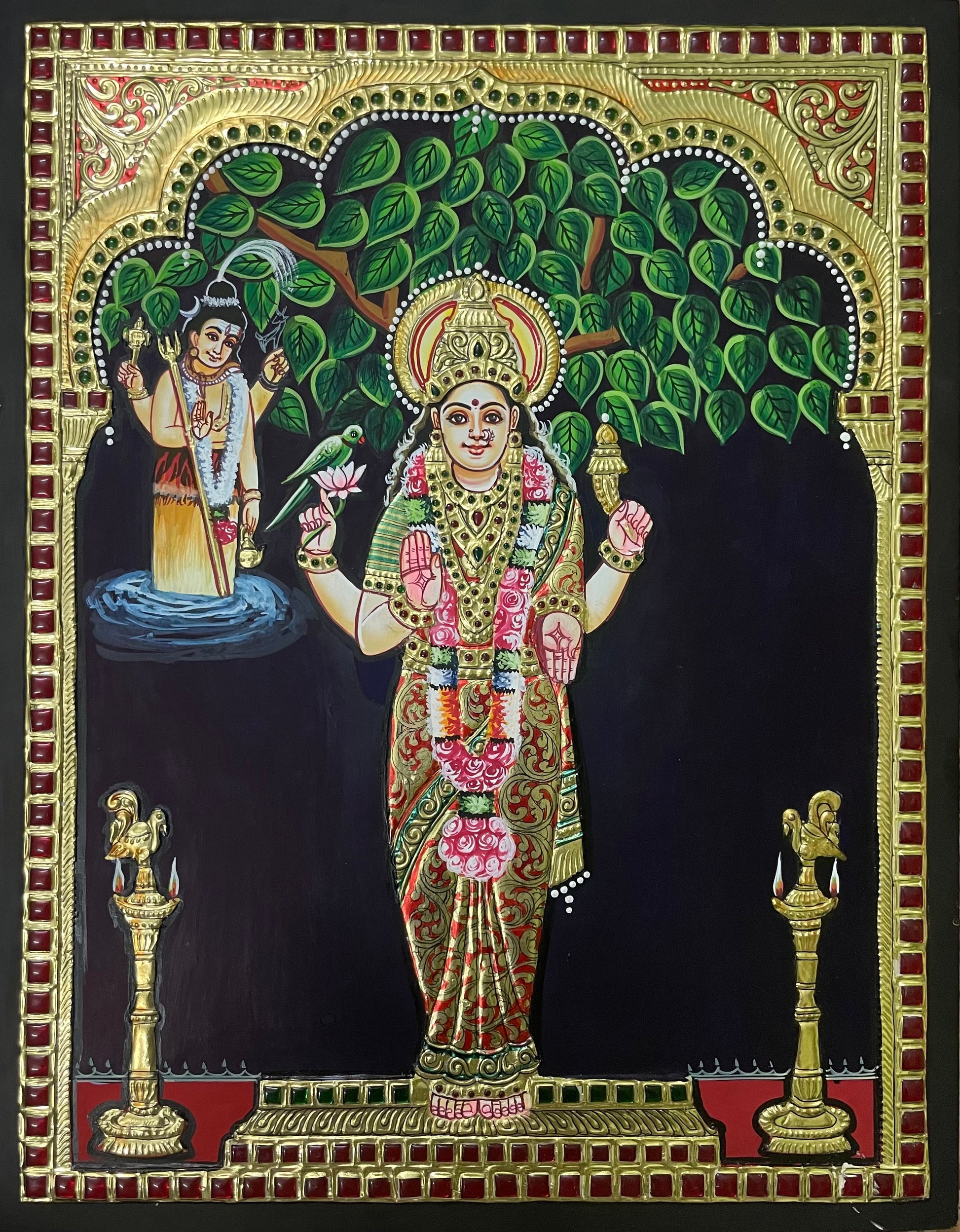 A close-up of the Kanyaka Parameswari Tanjore painting, highlighting the rich textures, golden embellishments, and serene expression of the goddess.

