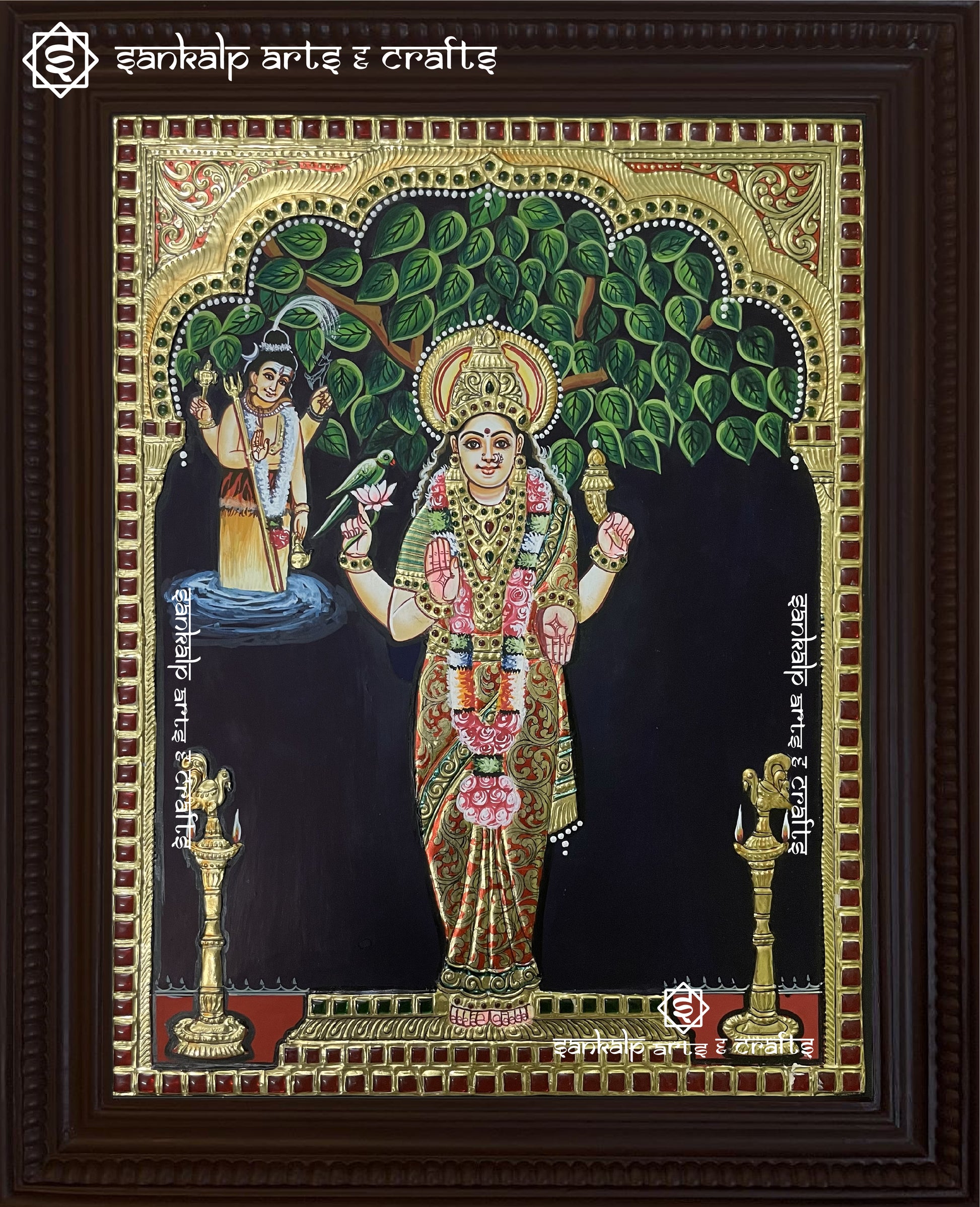 A beautifully detailed Kanyaka Parameswari Tanjore painting, showcasing the goddess in vibrant colors with intricate gold foil work and traditional artistic elements.

