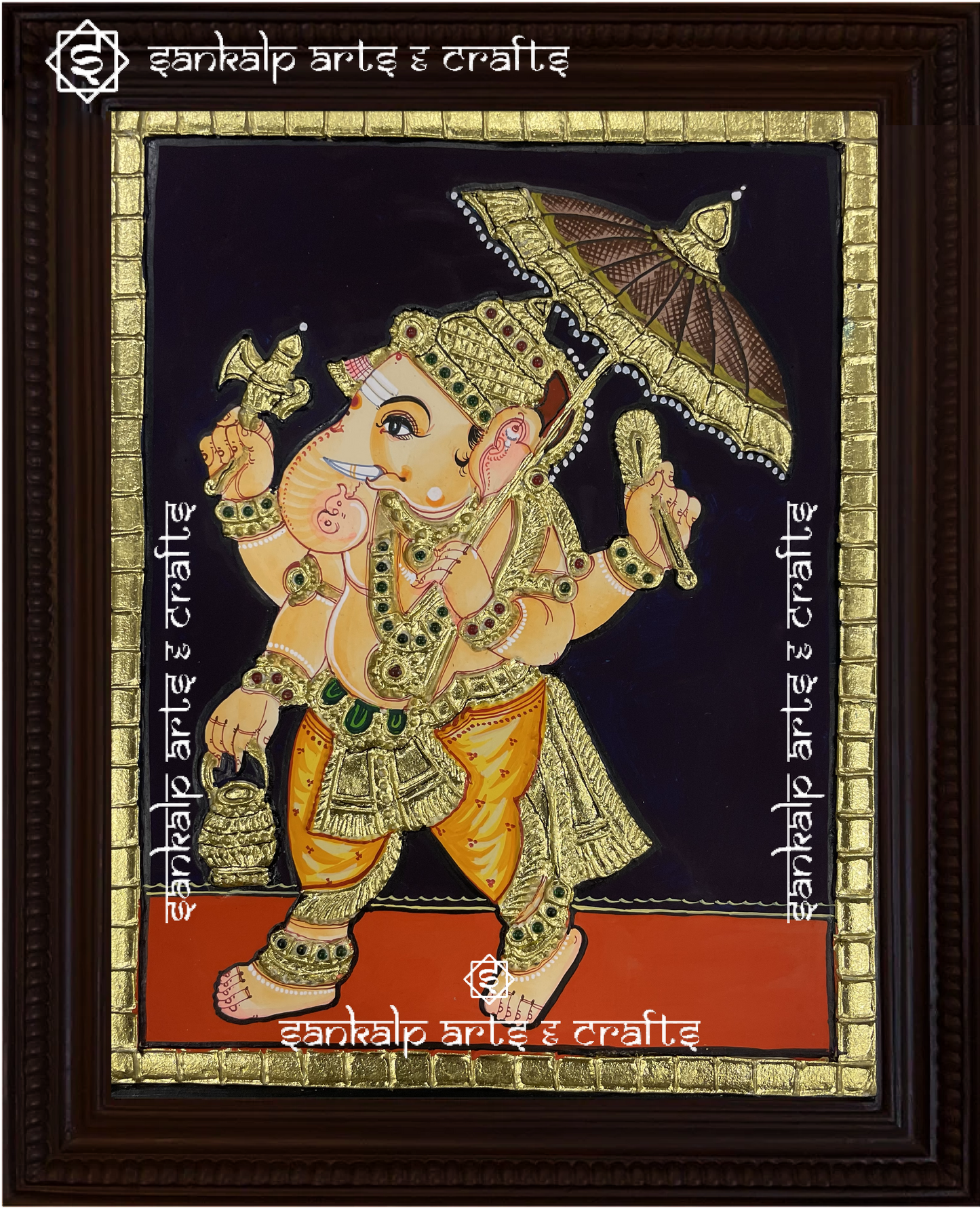 A beautifully framed Tanjore painting of Kodai Vinayagar, depicting Lord Ganesha with a majestic umbrella. A perfect decor piece for homes in Chennai & Bangalore.