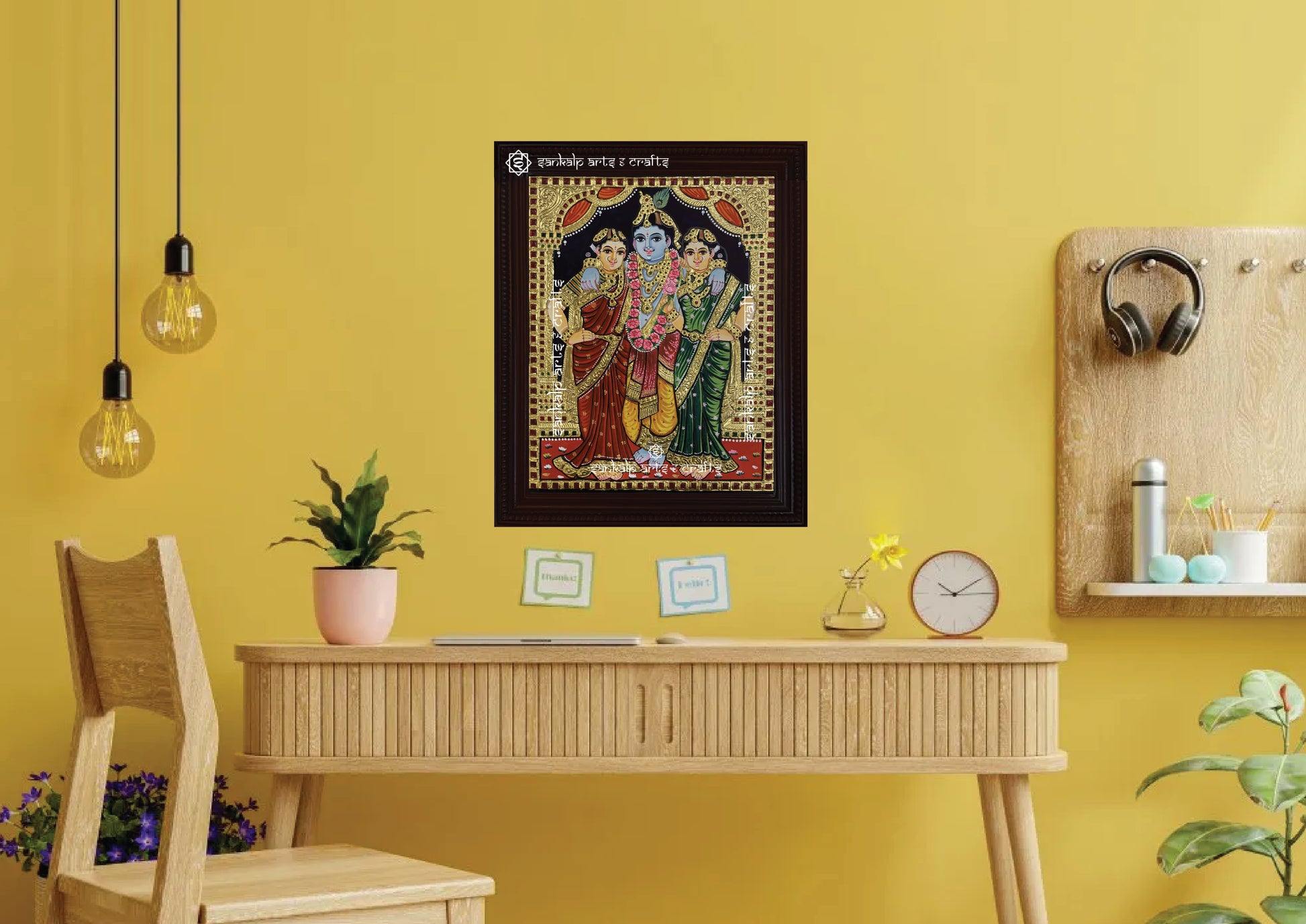 A framed Krishna Bama Rukmani Tanjore painting, radiating divine energy with intricate gold work and vibrant hues, perfect for adding spiritual elegance and charm to your pooja room or living space.

