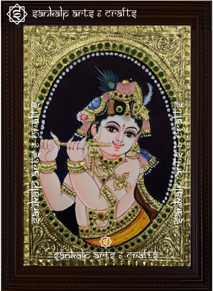 A beautifully handcrafted Krishna Tanjore painting depicting Lord Krishna in a divine pose, adorned with intricate gold foil detailing and vibrant colors, capturing his timeless grace and spirituality.


