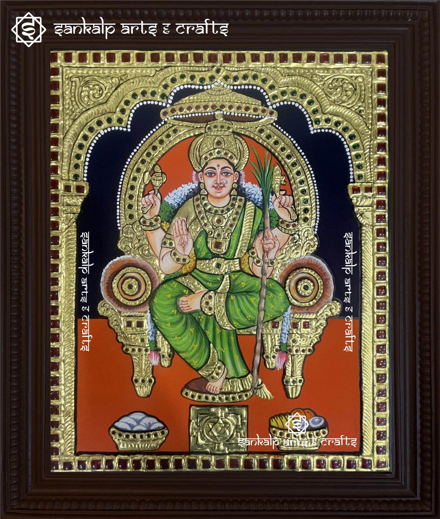 A stunning Lalitha Parameshwari Tanjore painting featuring the goddess seated gracefully with her Chakram, adorned with intricate gold foil work and vibrant traditional colors.