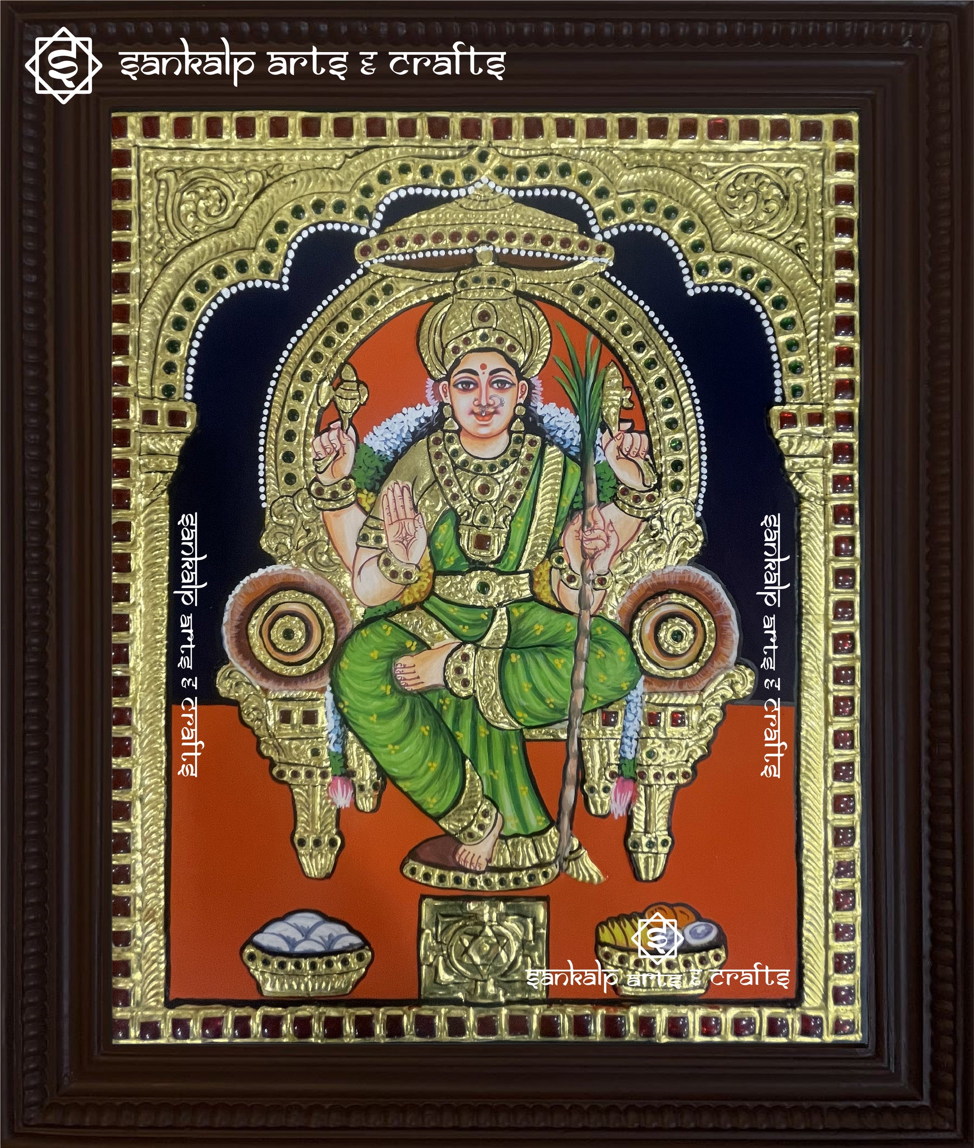 A stunning Lalitha Parameshwari Tanjore painting featuring the goddess seated gracefully with her Chakram, adorned with intricate gold foil work and vibrant traditional colors.