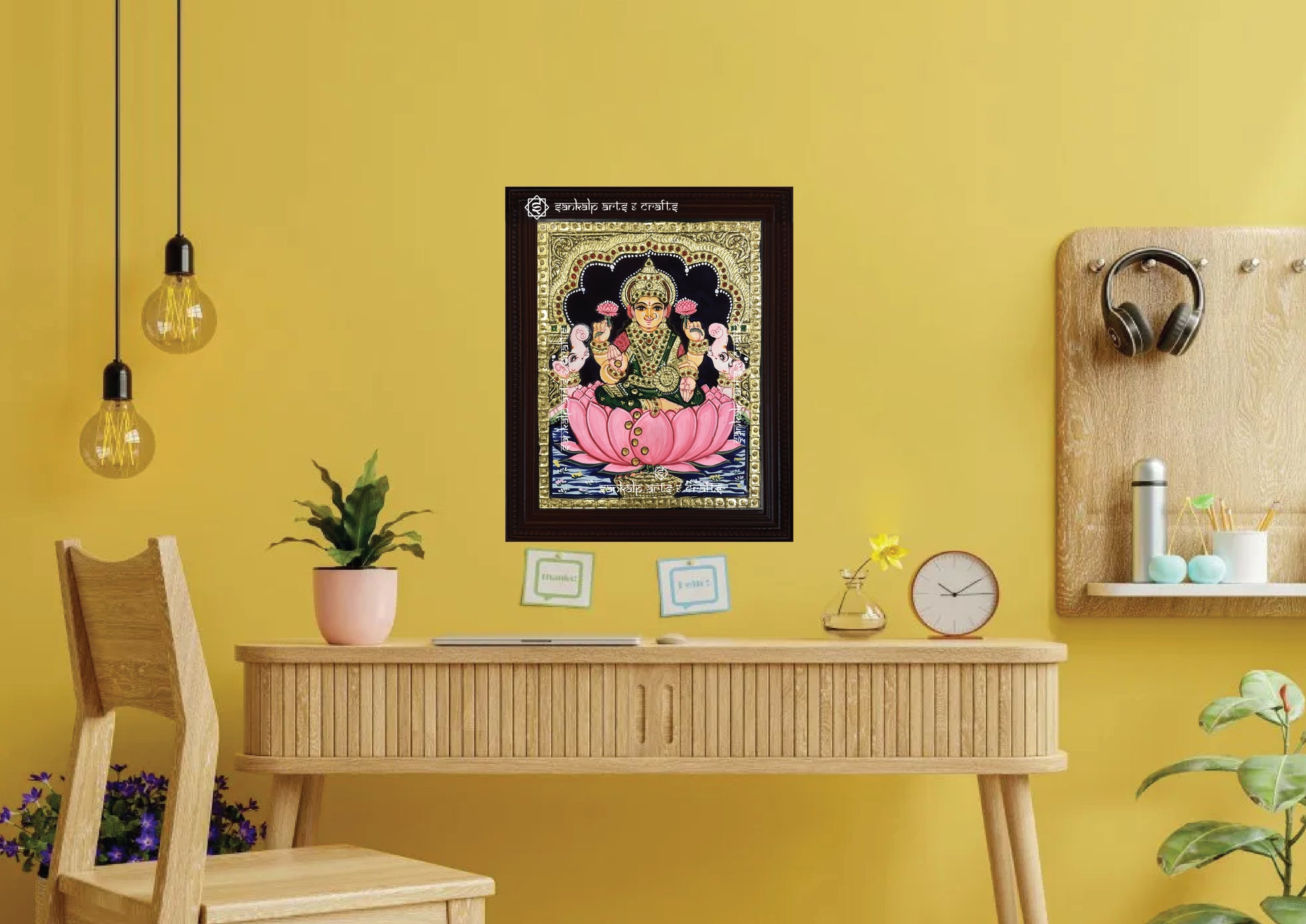 A framed Mahalakshmi Tanjore painting with vibrant hues and detailed gold work, enhancing spiritual ambiance. Available for purchase in Chennai & Bangalore.

