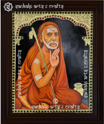 A handcrafted Mahaperiyava Tanjore painting featuring the revered Kanchi Paramacharya in serene meditation, highlighted by intricate gold foil detailing and vibrant colors. This artwork embodies wisdom, spirituality, and divine blessings.

