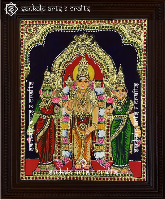 A stunning Tanjore painting of Lord Murugan with Goddess Valli and Deivanai, adorned with intricate gold foil work. A spiritual decor piece for homes in Chennai & Bangalore.

