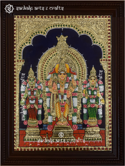 A stunning framed Tanjore painting of Lord Murugan with Goddess Valli and Deivanai, embellished with gold foil work. A perfect spiritual decor piece for homes in Chennai & Bangalore.


