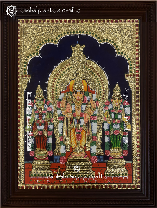 A stunning framed Tanjore painting of Lord Murugan with Goddess Valli and Deivanai, embellished with gold foil work. A perfect spiritual decor piece for homes in Chennai & Bangalore.

